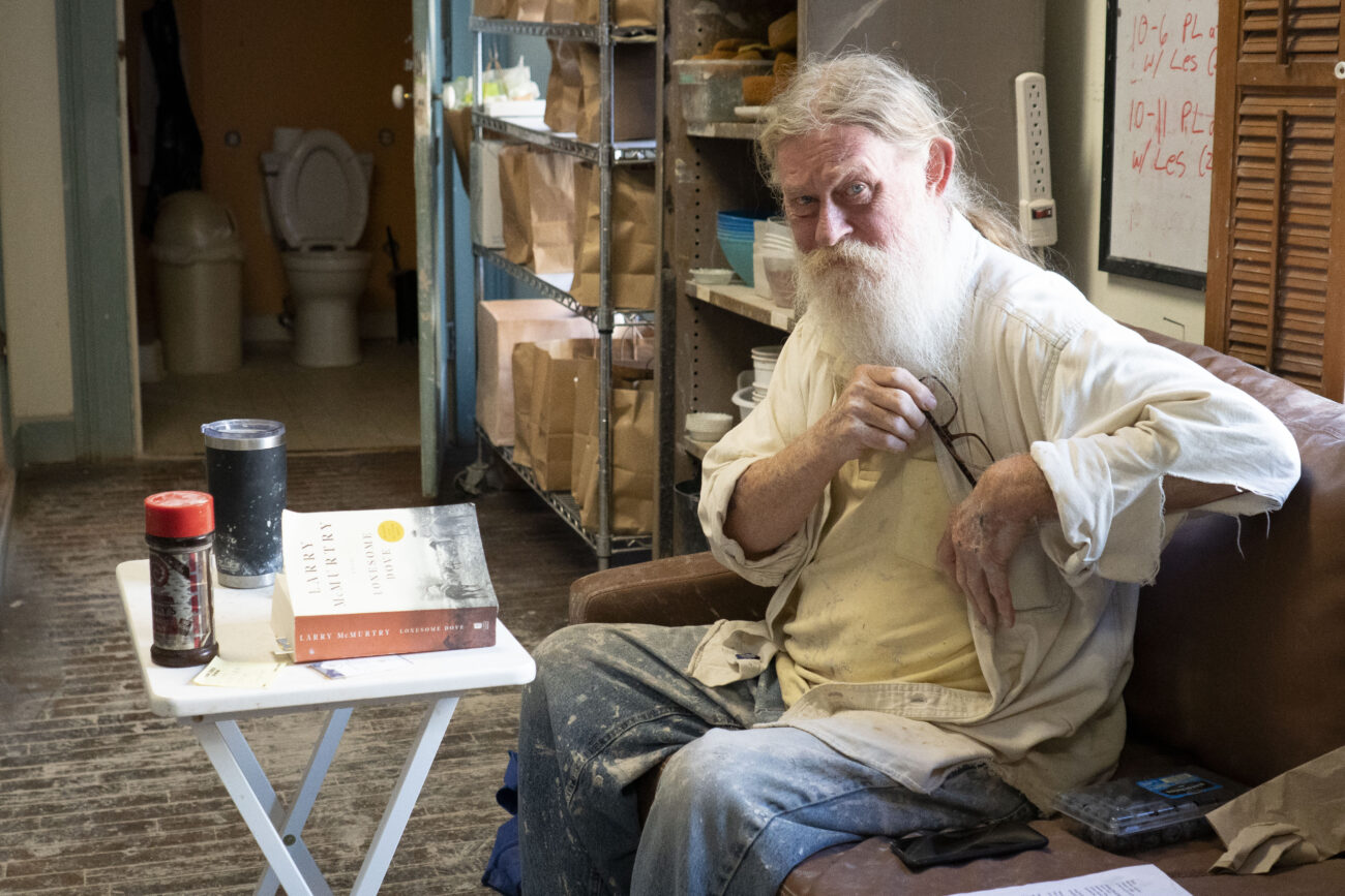 Leslie Greeman sits on his couch at the back corner of the store at Broadway Clay in Frankfort, Kentucky on Saturday, Oct. 8, 2022. Photo | Brooklyn Walters
