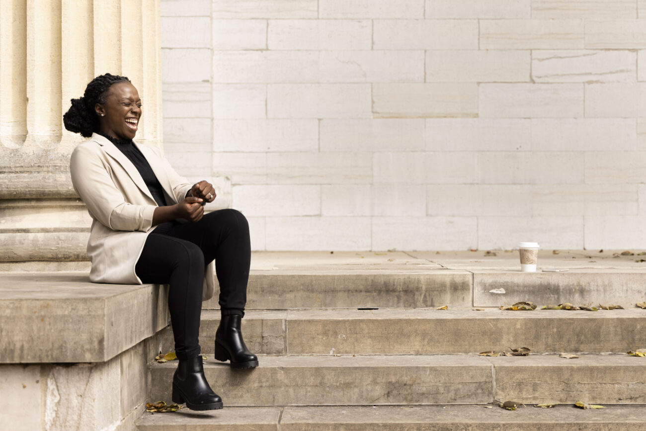 Katima Smith-Willis laughs in between photos for a portrait session for Protect Kentucky Access in downtown Frankfort, Kentucky on Friday, Oct. 7, 2022. Photo by Martha McHaney.
