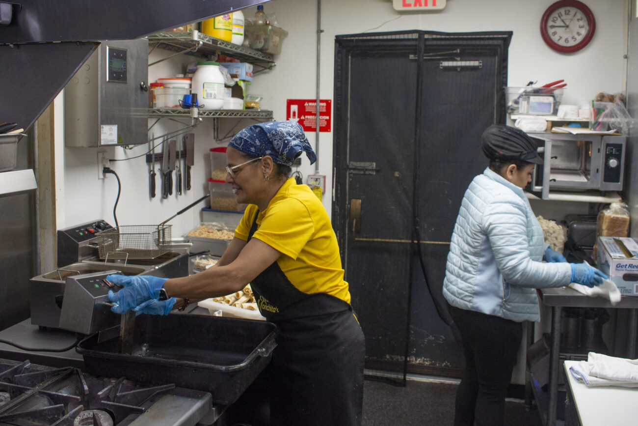 Alda Diaz turns on the deep fryer in the kitchen of her restaurant. She catered a local wedding and used the morning to prepare at Mami Monchita’s Honduran restaurant in Frankfort, Kentucky on Saturday, October 8, 2022. Photo | Nyah Leveretter