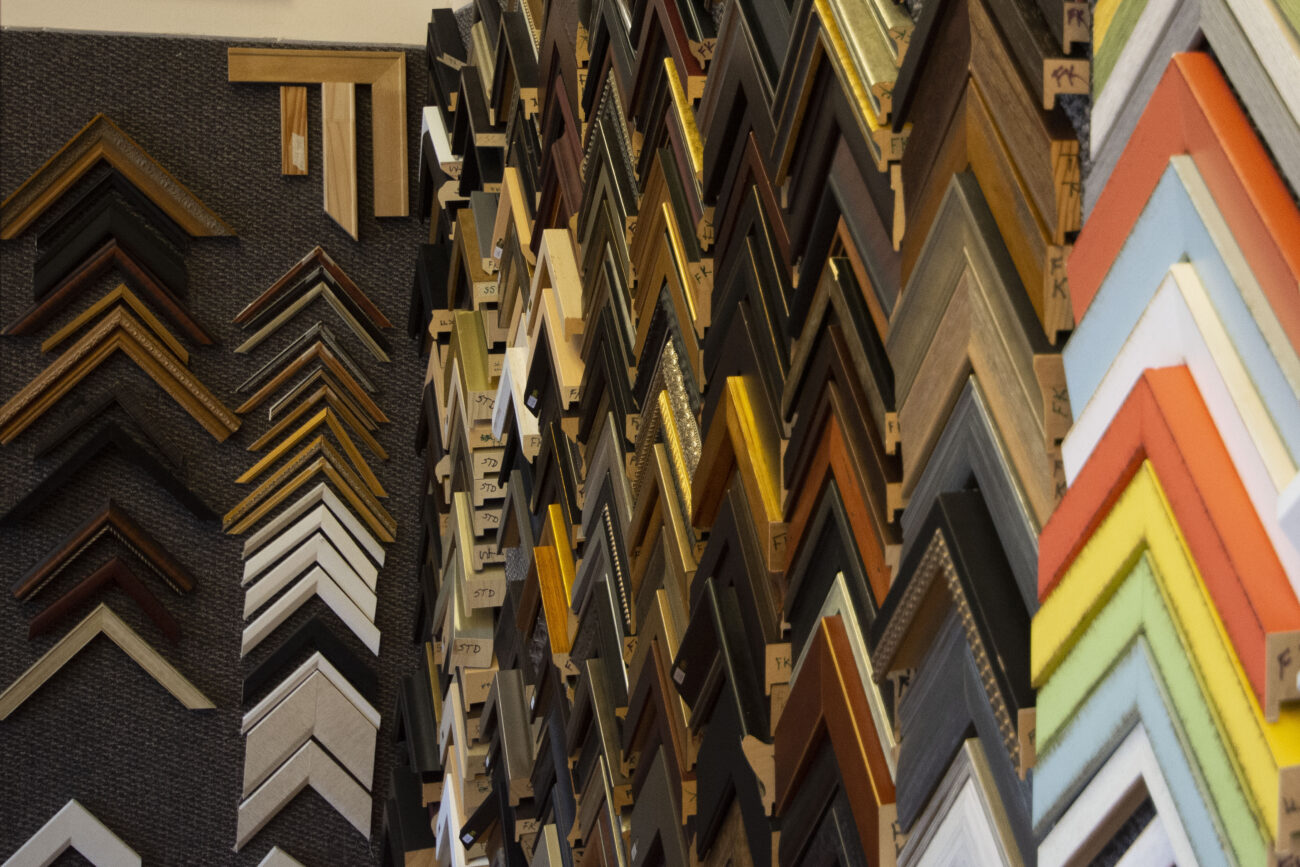Wooding and paint colors are shown off at Jessie’s Art Gallery and Custom Framing shop in Frankfort, Kentucky, on Thursday, October 6, 2022. The covered wall captures the eye as soon as eyes hit the door. Photo | Nyah Leveretter
