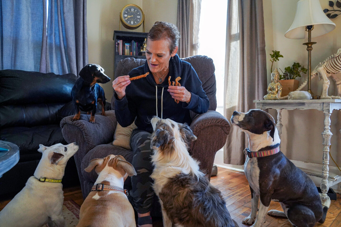 Jenny Hurst offers treats to the five dogs that reside in her home, four of which being her own and one being her daughter Mattie’s on Saturday, Oct. 8, 2022 in Frankfort, Ky. Photo by Carter Skaggs