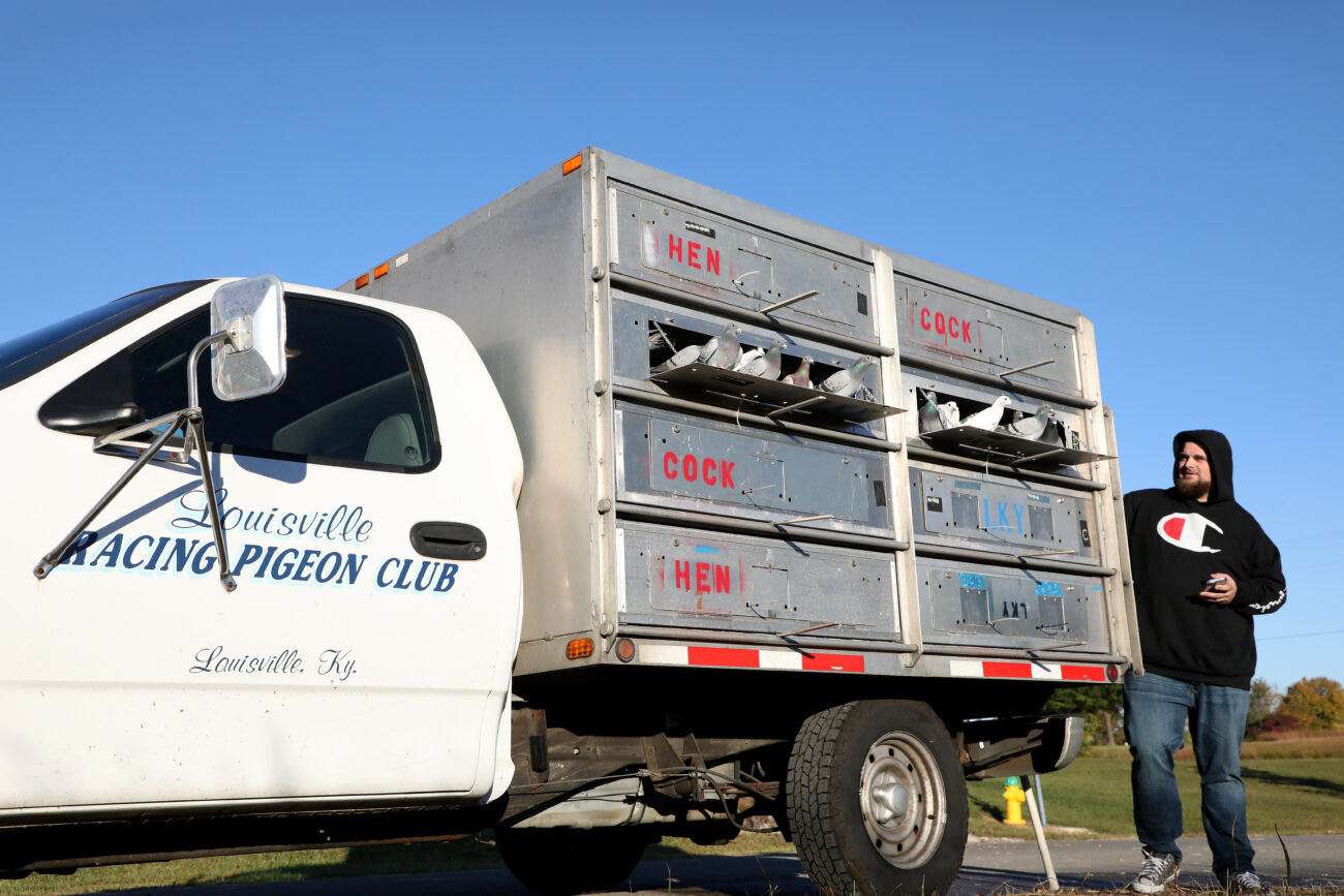 Charlies pigeons, along with the pigeons of other Lexington Racing Pigeon Club members, look onwards as they are released by Louisville Racing Pigeon Club member Aaron Jefferson and are about to take flight to begin their race back to their lofts outside of a Holiday Inn in Franklin, Kentucky.